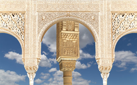 Arches in Islam (Moorish) style (against the background of a beautiful sky with clouds) in Alhambra, Granada, Spainの写真素材