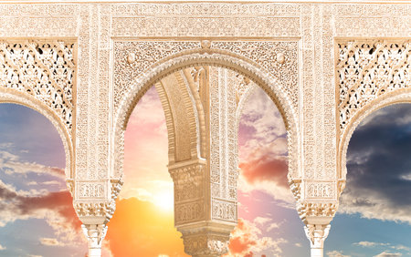 Arches in Islam (Moorish) style (against the sunset) in Alhambra, Granada, Spainの写真素材