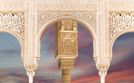 Arches in Islam (Moorish) style (against the sunset) in Alhambra, Granada, Spainの写真素材
