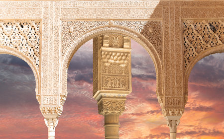 Arches in Islam (Moorish) style (against the sunset) in Alhambra, Granada, Spainの写真素材