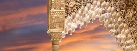 Arches in Islam (Moorish) style (against the sunset) in Alhambra, Granada, Spainの写真素材