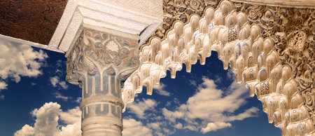 Arches in Islam (Moorish) style (against the background of a beautiful evening sky with clouds) in...