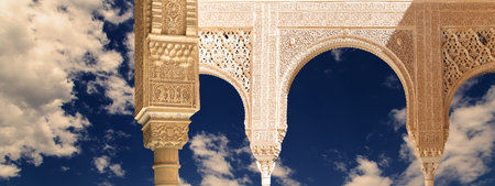 Arches in Islam (Moorish) style (against the background of a beautiful evening sky with clouds) in...