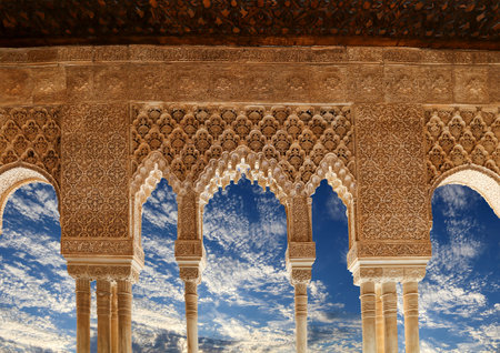 Arches in Islamic (Moorish) style (against the background of a beautiful sky with clouds) in...