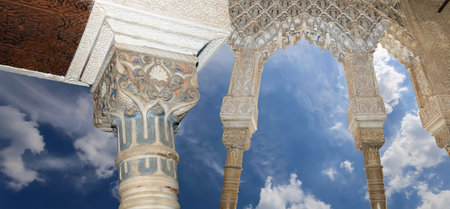 Arches in Islamic (Moorish) style (against the background of a beautiful sky with clouds) in...