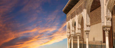Arches in Islamic (Moorish) style (against the sunset) in Alhambra, Granada, Spainの写真素材