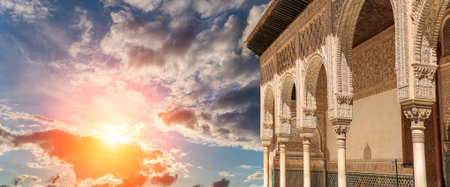 Arches in Islamic (Moorish) style (against the sunset) in Alhambra, Granada, Spainの写真素材