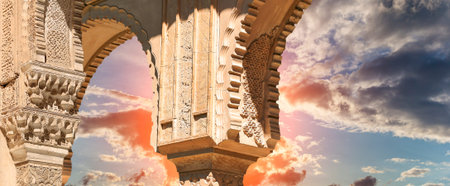 Arches in Islamic (Moorish) style (against the sunset) in Alhambra, Granada, Spain