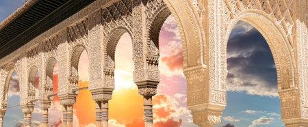 Arches in Islamic (Moorish) style (against the sunset) in Alhambra, Granada, Spain
