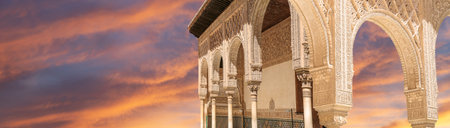 Arches in Islamic (Moorish) style (against the sunset) in Alhambra, Granada, Spain