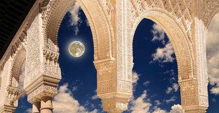 Arches in Islamic (Moorish) style (against the background of a beautiful evening sky with clouds...