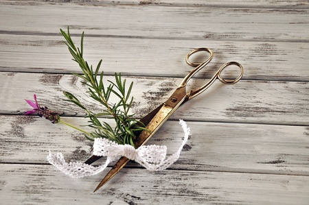 Rosemary branch and lavender caught in the scissors with lace loopの写真素材