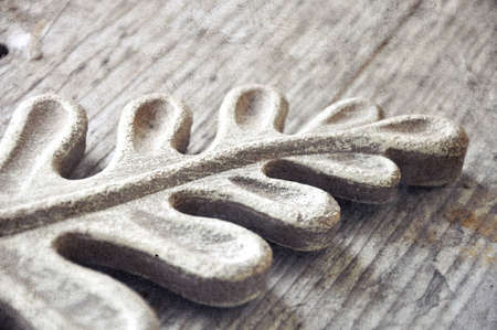 wooden decorative designed branch on grey woodの写真素材