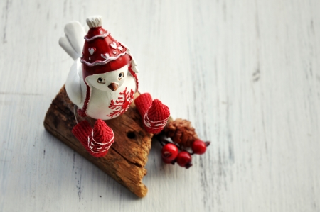Ceramic bird with red hat and socksの写真素材
