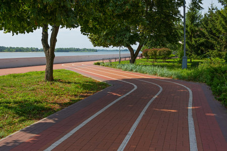 Bicycle path on the embankment of the Dnieper River in the city of Kremenchuk, Ukraine. summer sunny...