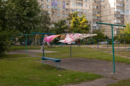 Laundry dries on a rope and is blown by the wind in the courtyard of a residential area. Horishni Plavni city, Ukraineの写真素材