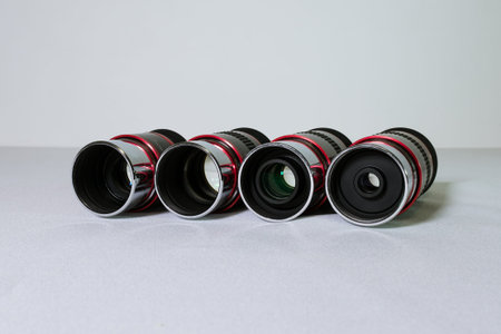 Eyepieces for a telescope on a white background