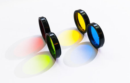 Optical glass colored filters in an iron frame close-up on a white backgroundの写真素材