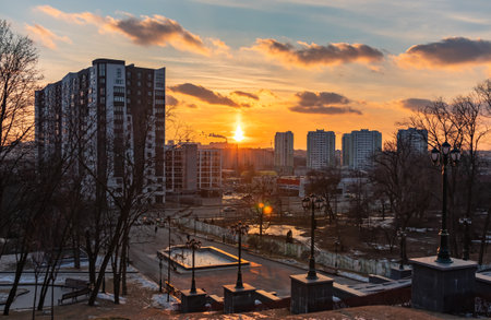 Kharkiv city, Ukraine - February 22, 2023: Beautiful sunset over the panorama of city. Shevchenko Garden in winterのeditorial素材