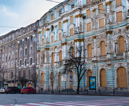 Kharkiv city, Ukraine - February 22, 2023: Buildings with beautiful architecture suffered from the shelling of the Russian army. Boarded up windows and damaged facadeのeditorial素材