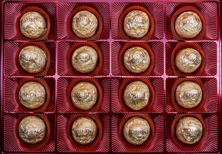 Kharkiv city, Ukraine - March 19, 2023: Candies Roshen in a box Chocolate sweets in golden foilのeditorial素材