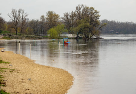 Spring flood on the banks of the Dnieper river in Kremenchuk city, Ukraine. water flooded the beach