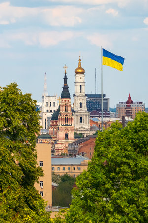 View of the center of Kharkiv city in Ukraine. Cityscape with buildings, church and flag of Ukraine