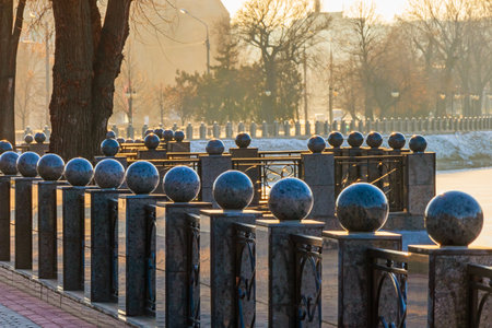 Stone balls on the fence of the embankment near the river in Kharkiv city, Ukraineの写真素材