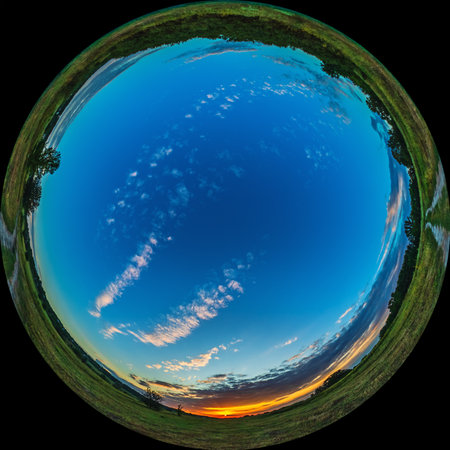 Fisheye landscape sunrise over meadow. All sky in HDR photo taken through circular lens 180 degree viewの写真素材