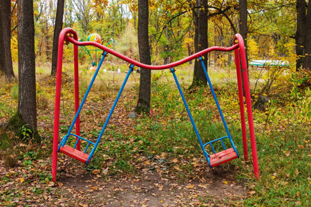 A children's metal swing is damaged, and the iron pipe is bent by a fallen tree. An abandoned...