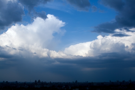Dramatic cloudscape in city, stormy skyの写真素材