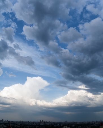 Dramatic cloudscape in city, stormy sky, panoramの写真素材