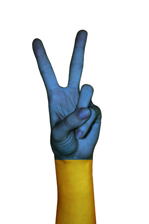 Hand covered in flag of Ukraineの写真素材