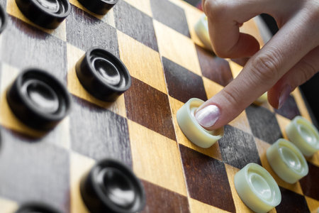 Close-Up Woman Playing Checkersの写真素材