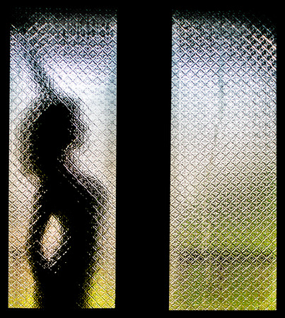 Silhouette of Woman Stretching Herselfの写真素材