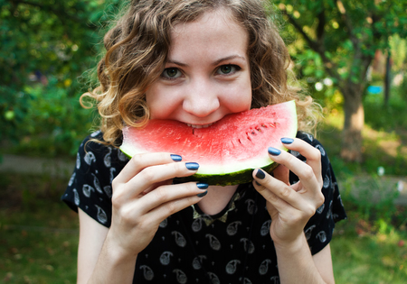 Cheerful Girl with Watermelonの写真素材