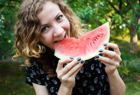 Cheerful Girl with Watermelon
