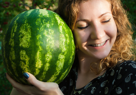 Cheerful Girl with Watermelonの写真素材