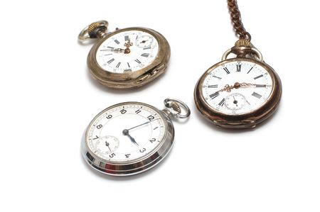 Three old broken pocket watch isolated on whiteの写真素材