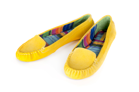 Beautiful yellow women shoes isolated on white backgroundの写真素材
