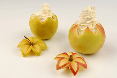 Two apples stuffed with whipped creamの写真素材