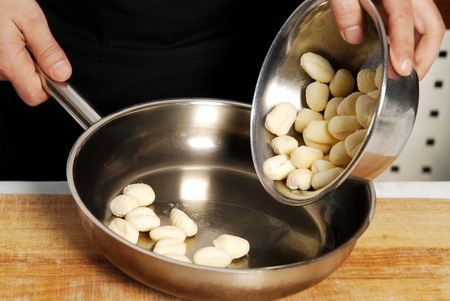 Man preparing ravioli in the kitchen, detailの写真素材