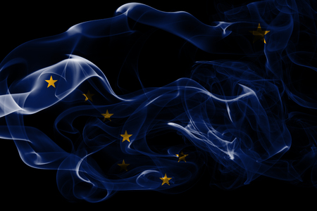National flag of Alaska made from colored smoke isolated on black background. Abstract silky wave background.の写真素材