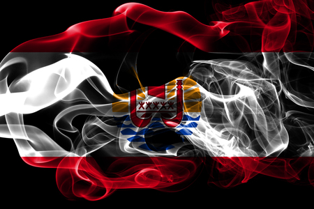 National flag of French Polynesia made from colored smoke isolated on black background. Abstract silky wave background.の写真素材