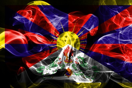 National flag of Tibet made from colored smoke isolated on black backgroundの写真素材