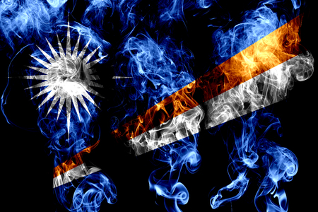 National flag of Marshall Islands made from colored smoke isolated on black backgroundの写真素材