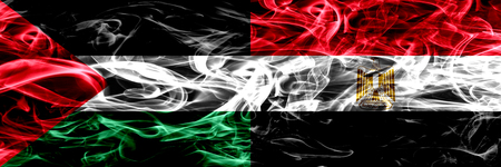 Palestine vs Egypt, Egyptian smoke flags placed side by side. Thick colored silky smoke flags of Palestinian and Egypt, Egyptianの写真素材