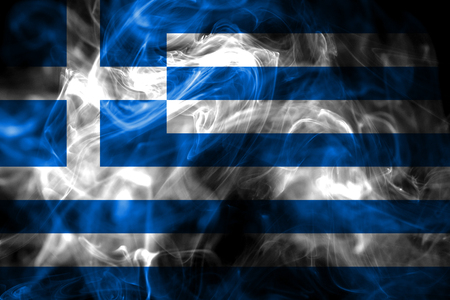 National flag of Greece made from colored smoke isolated on black background. Abstract silky wave background.の写真素材