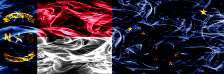 North Carolina vs Alaska colorful concept smoke flags placed side by sideの写真素材