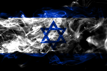 National flag of Israel made from colored smoke isolated on black background. Abstract silky wave backgroundの写真素材